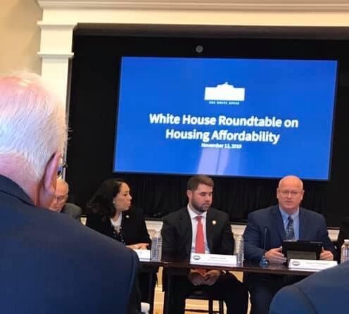 Kevin Thompson addressing White House staff on barriers to affordable housing.